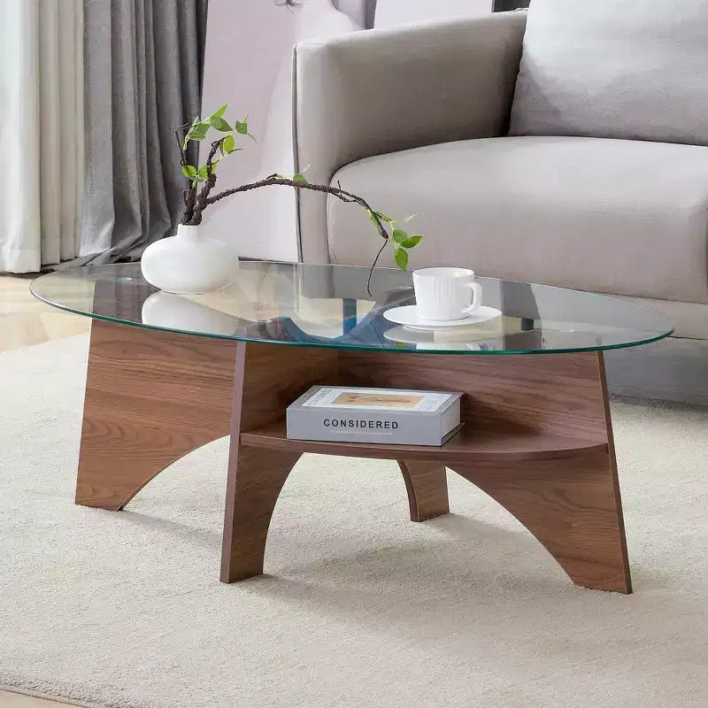 Runder Couchtisch aus Glas, ovaler Cocktailtisch, ovaler Mitteltisch, Akzenttisch, Sofatisch mit diagonal angeordnetem fächerförmigem Ablagebein, Walnuss/Natur